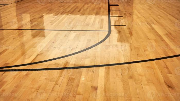 interior of empty modern basketball indoor sport court semigloss coating wooden floor artificial lights reflected photo 2 - Memahami Lantai Lapangan Basket Performa, Keamanan, dan Perawatan